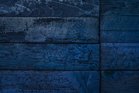 blue mysterious wooden planks texture partly peeled grunge surface background for designの写真素材