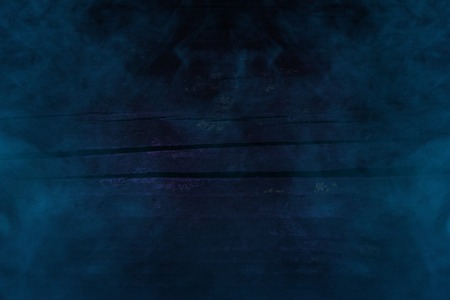 cracked plank of wooden wall close-up mysterious blue fog background for design halloween conceptの写真素材