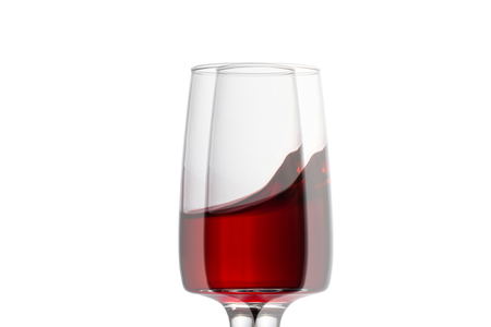 distorted glass of red wine bewitching splash similar to a small wave object for designの写真素材