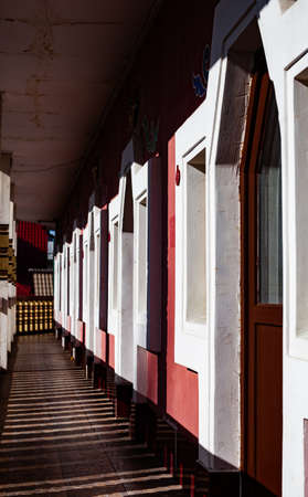 a corridor with stone openings for doors and windows extending into the distanceの写真素材