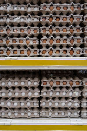 fresh eggs lying in cardboard boxes on a rack. High quality photoの写真素材