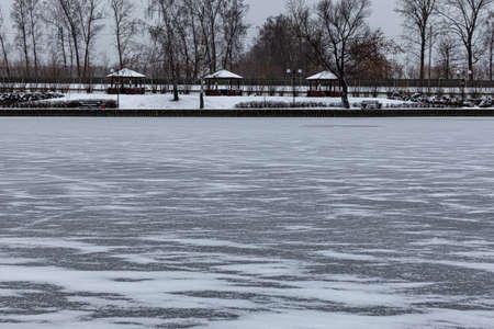 thin first ice on a pond in a recreation park. High quality photoの写真素材