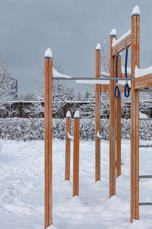 sports equipment covered with snow in the park in winter. High quality photo
