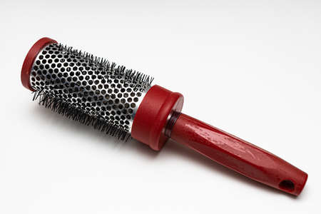 plastic round comb with hair stuck in it. High quality photoの写真素材