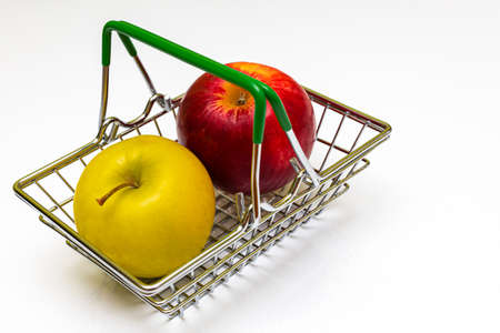 fresh apples of different colors lie in a metal basket. high quality photoの写真素材