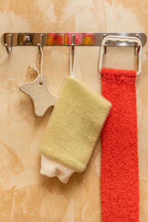 a simple metal hanger in the bathroom on which a washcloth hangsの写真素材