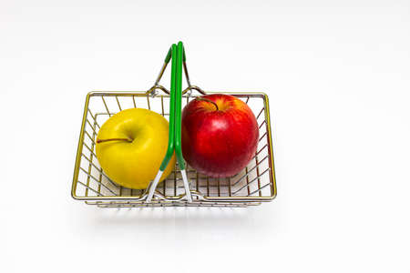 fresh apples of different colors lie in a metal basket. high quality photoの写真素材