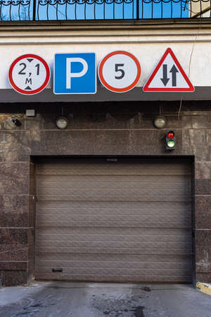Moscow, Russia - March 19, 2022: closed gate to the parking lot over which a sign hangs.のeditorial素材