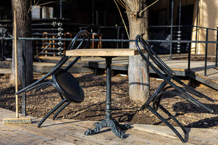 a chair wrapped around a table on the veranda. high quality photoの写真素材