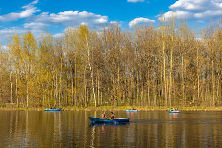 Moscow, Russia - May 07, 2022: a boat with people floats on a pond. high quality photo