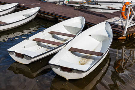 a cluster of pleasure boats on a wooden pier. high quality photoの写真素材