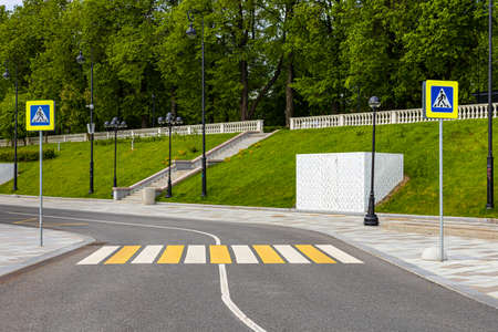 pedestrian crossing across the road with zebra crossings and signs. high quality photoの写真素材