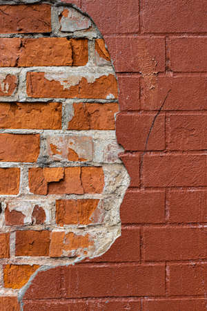 fragment of a brick wall with broken plaster. high quality photoの写真素材