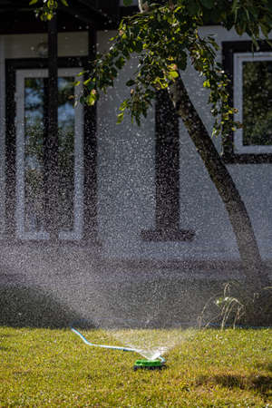 watering system at work on the front lawn. high quality photoの写真素材