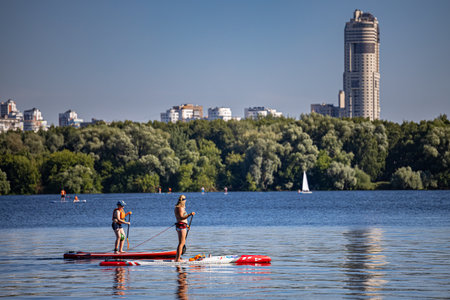 Moscow, Russia - July 01, 2022: woman doing rowing workout on board. high quality photoのeditorial素材