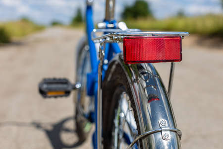 red reflector on the trunk of a bicycle close-up. high quality photo