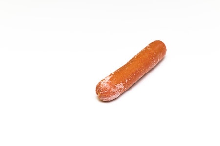 frozen sausage with traces of frost on a white background. hot dog sausageの写真素材