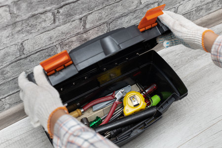 the master opens the box with the tool. toolbox. high quality photo