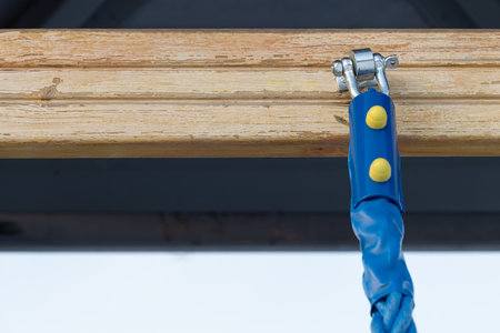 metal rope fastening on the sports ground. rope on the playground. metal mount.