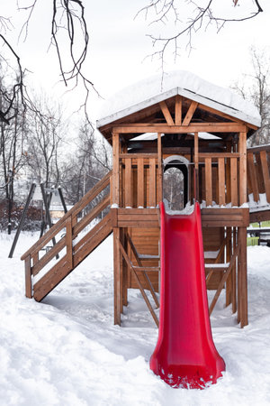 children's slide in the children's park in winter. empty children's slide.の写真素材