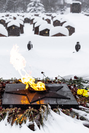 Moscow, Russia - December 19, 2022: eternal flame at the military cemetery. military cemetery in winter. monument in the cemetery.のeditorial素材