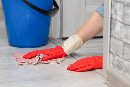 man mopping the floor with a rag. wet house cleaning. woman mopping the floor.