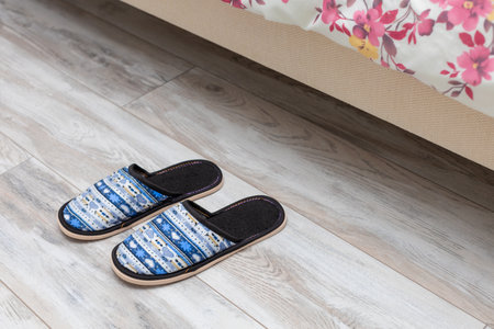 slippers by the bed. slippers in the bedroom. high quality photo