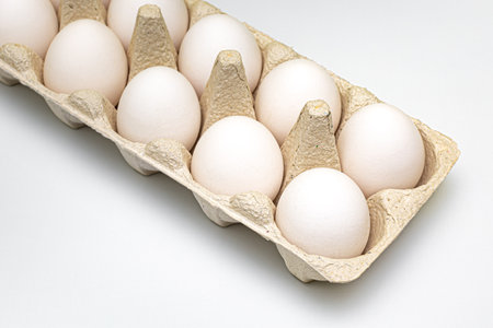 white chicken eggs are in the package. eggs in packaging for transport