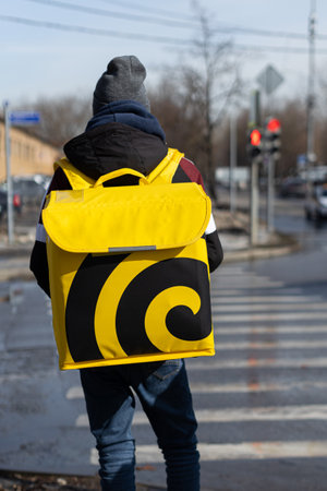 Moscow, Russia - March 20, 2023: delivery man on the city street. delivery service. . high quality photoのeditorial素材