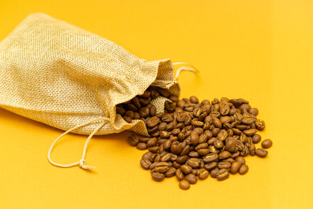coffee beans spilled out of the bag. natural coffee beans. high quality photoの写真素材