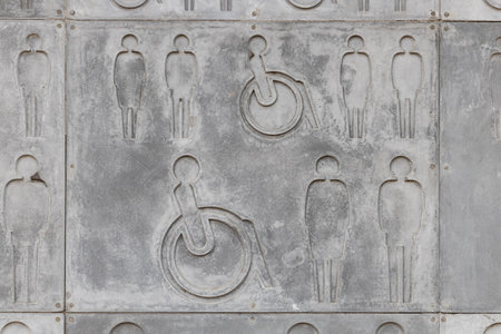 stone tiles with symbols of people of different status. symbol for a person. public toilet signs