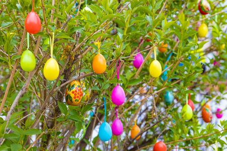 Moscow, Russia - May 05, 2023: decorative easter egg hanging on a tree. easter egg on the tree