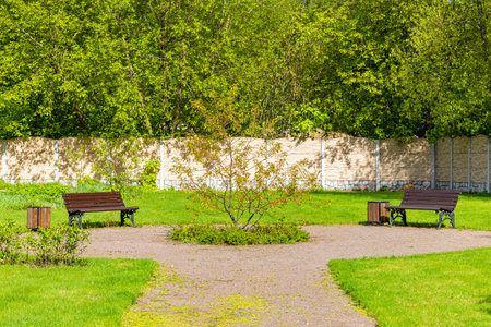 path leading to a small park with benches. benches in the parkの写真素材