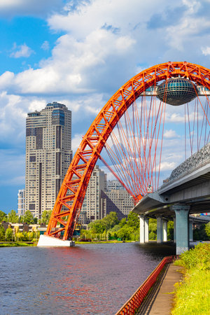 Moscow, Russia - June 07, 2023: picturesque bridge over the river. red bridge. The height of the arches is over 100 m.のeditorial素材