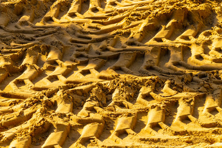 tracks from the wheels of a large transport on the sand. wheel tread marks in the sandの写真素材