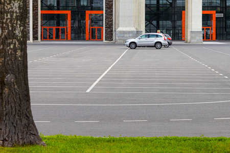 Moscow, Russia - July 10, 2023: one car in an empty parking lot. free parking space. car in an empty parking lotのeditorial素材