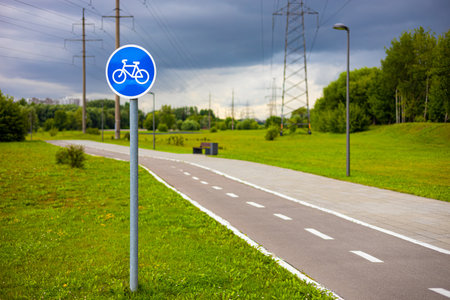 road sign with a picture of a bicycle on a cycle path. empty bike path in the park. high quality photoの写真素材