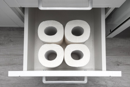 several rolls of paper towels in the kitchen drawer. paper towel in the closet. kitchen drawerの写真素材