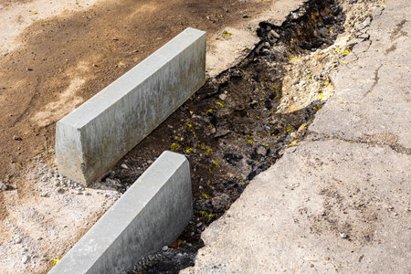 laying curb stones on a sidewalk in the city. curb stone on the road. sidewalk repair. High quality photoの写真素材