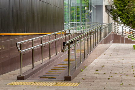 a long ramp leading up to the entrance of the building. comfortable environment for people with...