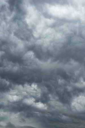 the sky is covered with black clouds. stormy sky. stormy sky background. bad weather black clouds.