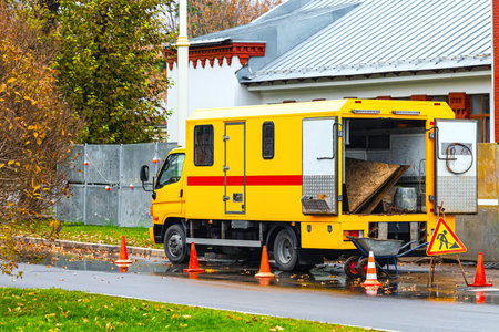 Moscow, Russia - October 20, 2025: yellow city utility vehicle. repair of city infrastructure....