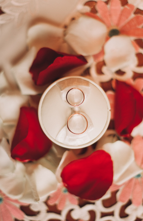 luxury wedding rings with stylish decoration near them.の写真素材