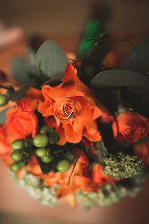 Pretty good wedding bouquet of various flowers with rings.の写真素材