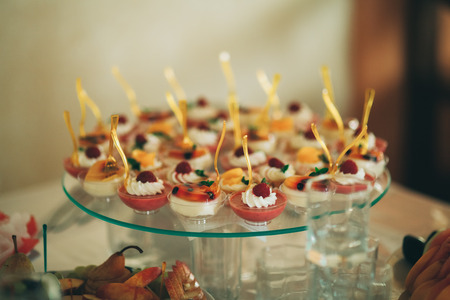 Different delicious desserts and cakes on the buffet table.の写真素材
