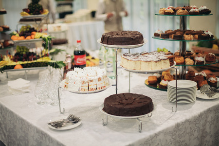 Different delicious desserts and cakes on the buffet table.の写真素材