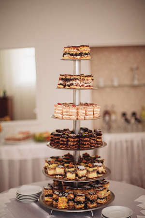 Different delicious desserts and cakes on the buffet table.の写真素材