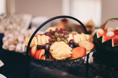 Various sweet sliced fruit on a buffet table.の写真素材