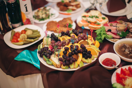 Various sweet sliced fruit on a buffet table.の写真素材