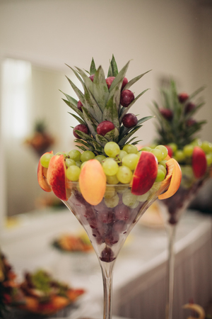 Various sweet sliced fruit on a buffet table.の写真素材